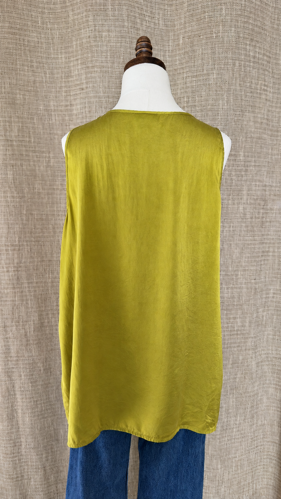 J.Jill chartreuse silk top on mannequin, back view