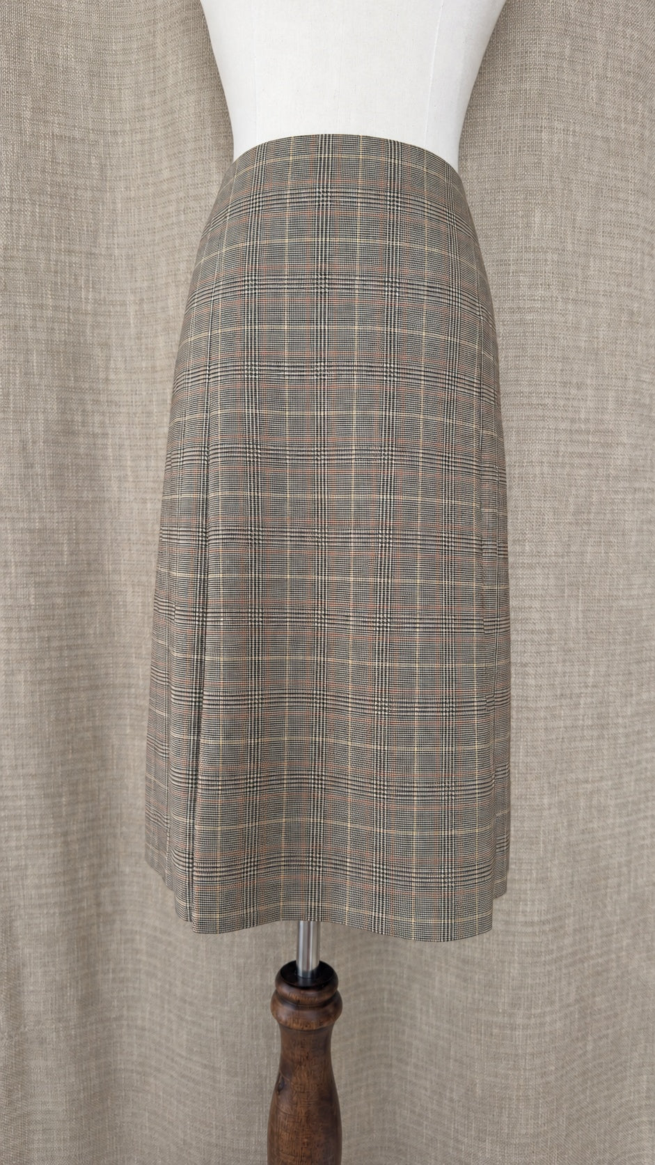 Brooks Brothers tan and brown plaid wool skirt on mannequin, front view