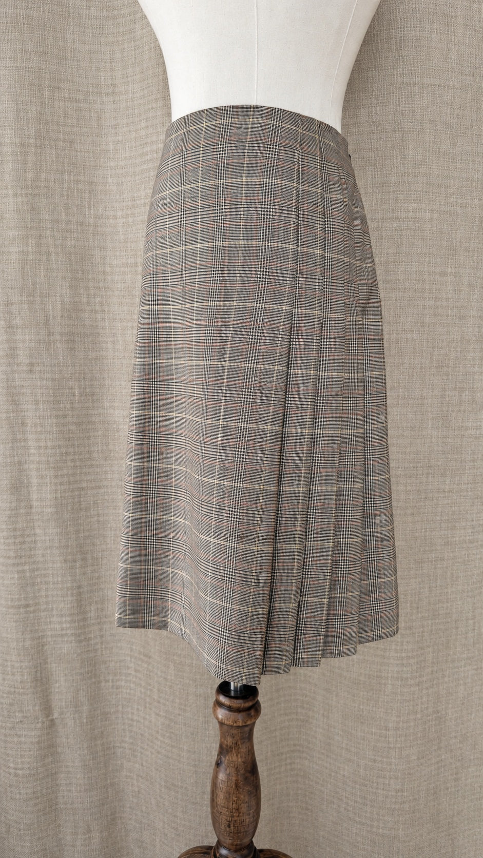 Brooks Brothers tan and brown plaid wool skirt on mannequin, side view