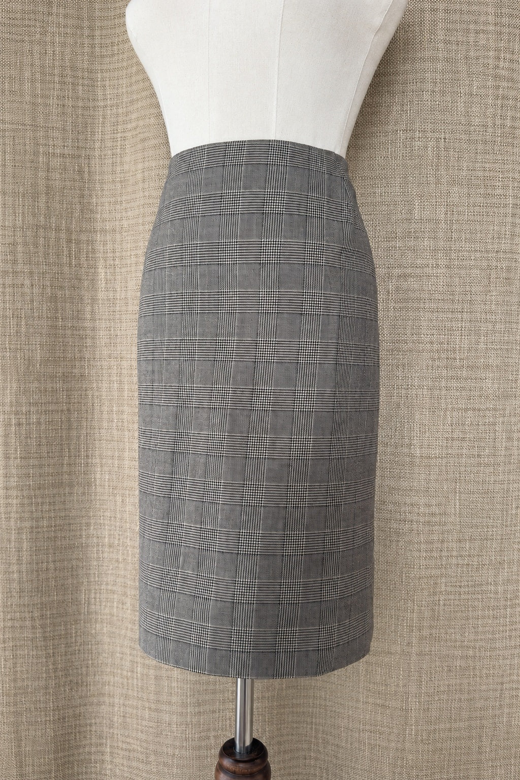 Akris punto plaid wool skirt on mannequin, front-side view