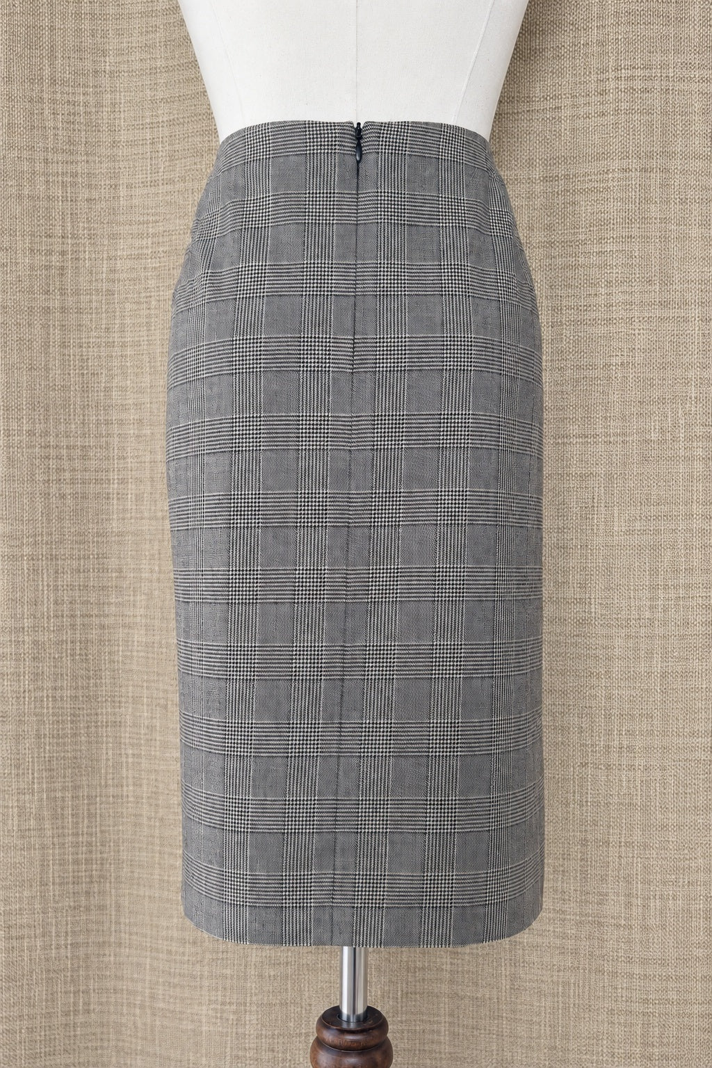 Akris punto plaid wool skirt on mannequin, back view