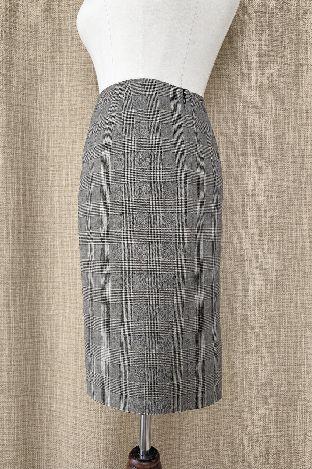 Akris punto plaid wool skirt on mannequin, alternate side view