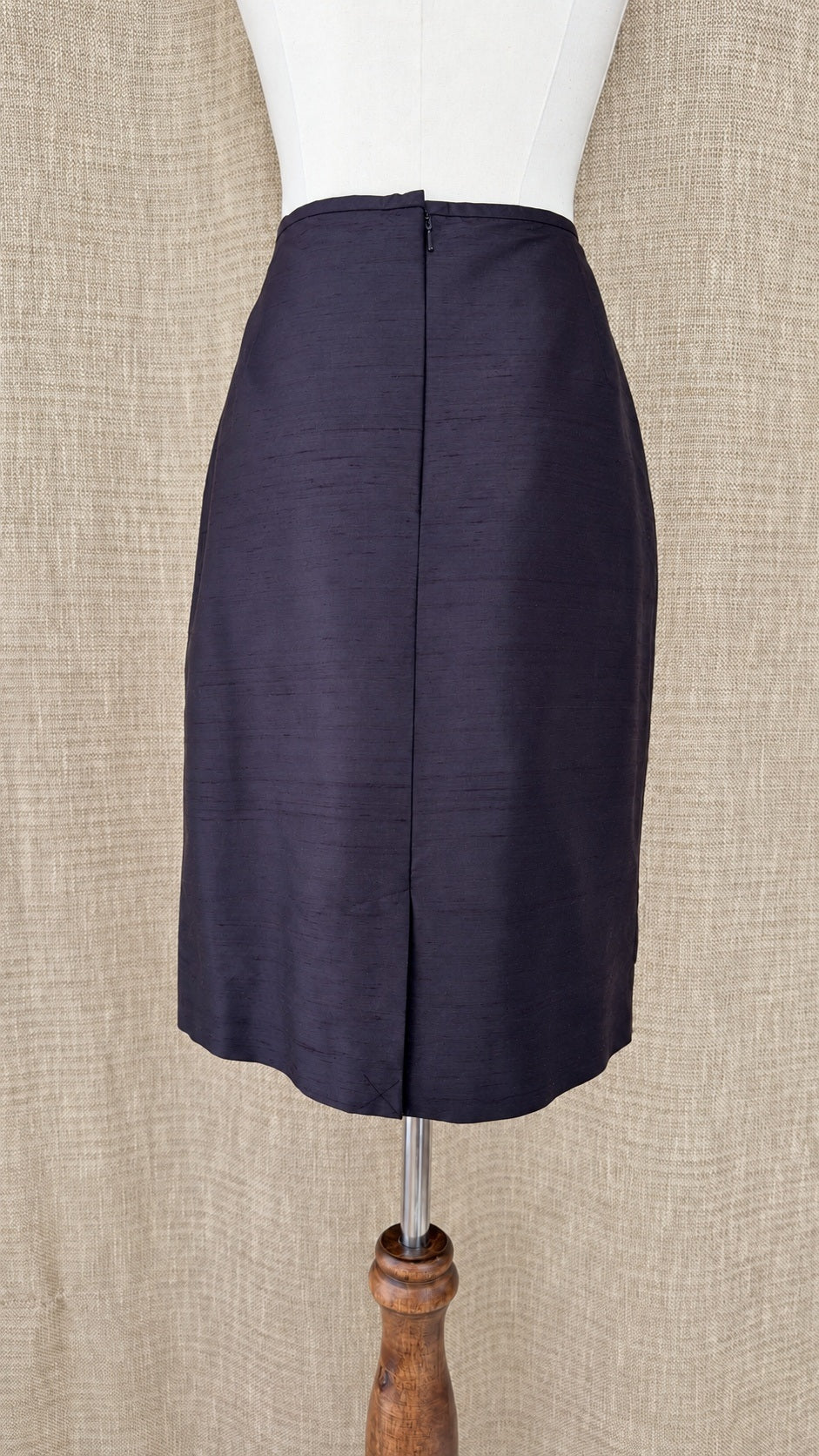 Casual Corner dark silk skirt on mannequin, back view