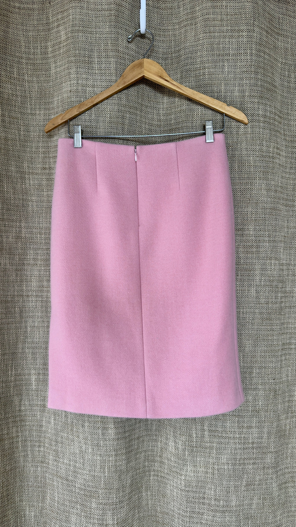 Light pink wool-angora skirt on hanger, back view