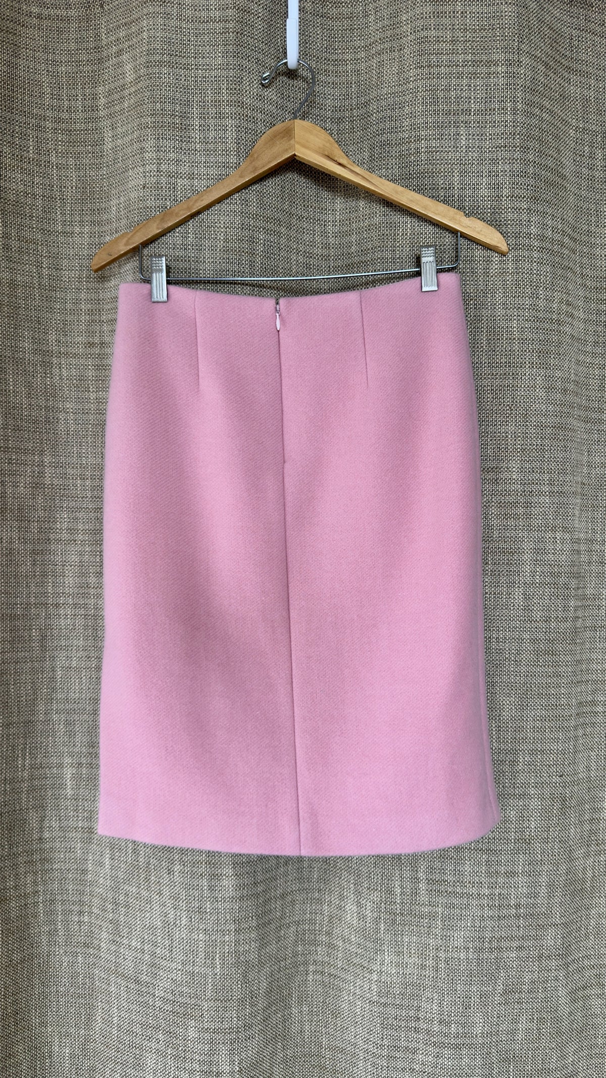 Light pink wool-angora skirt on hanger, back view