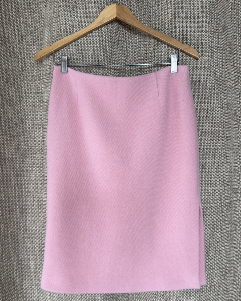 Light pink wool-angora skirt on hanger, front view
