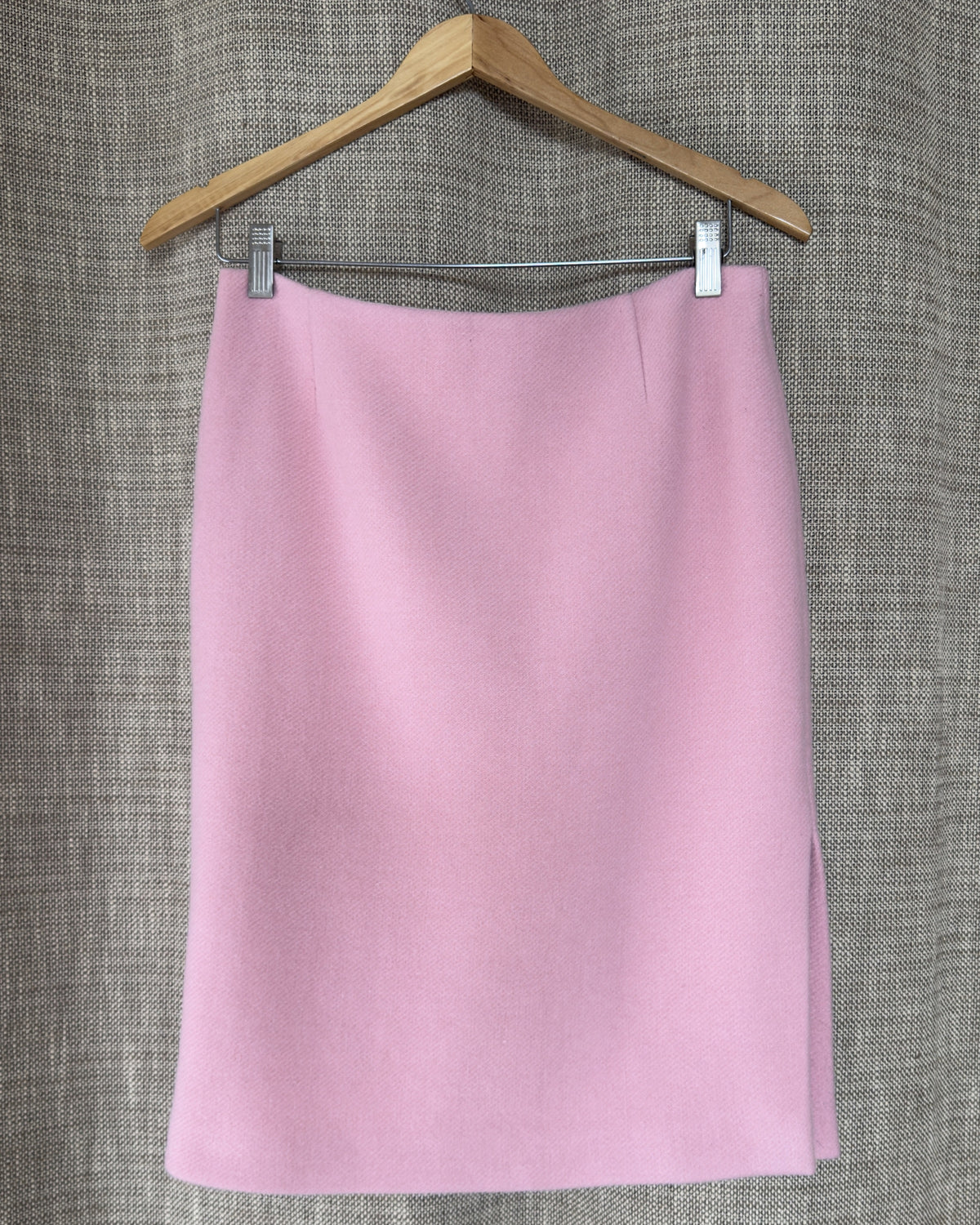 Light pink wool-angora skirt on hanger, front view