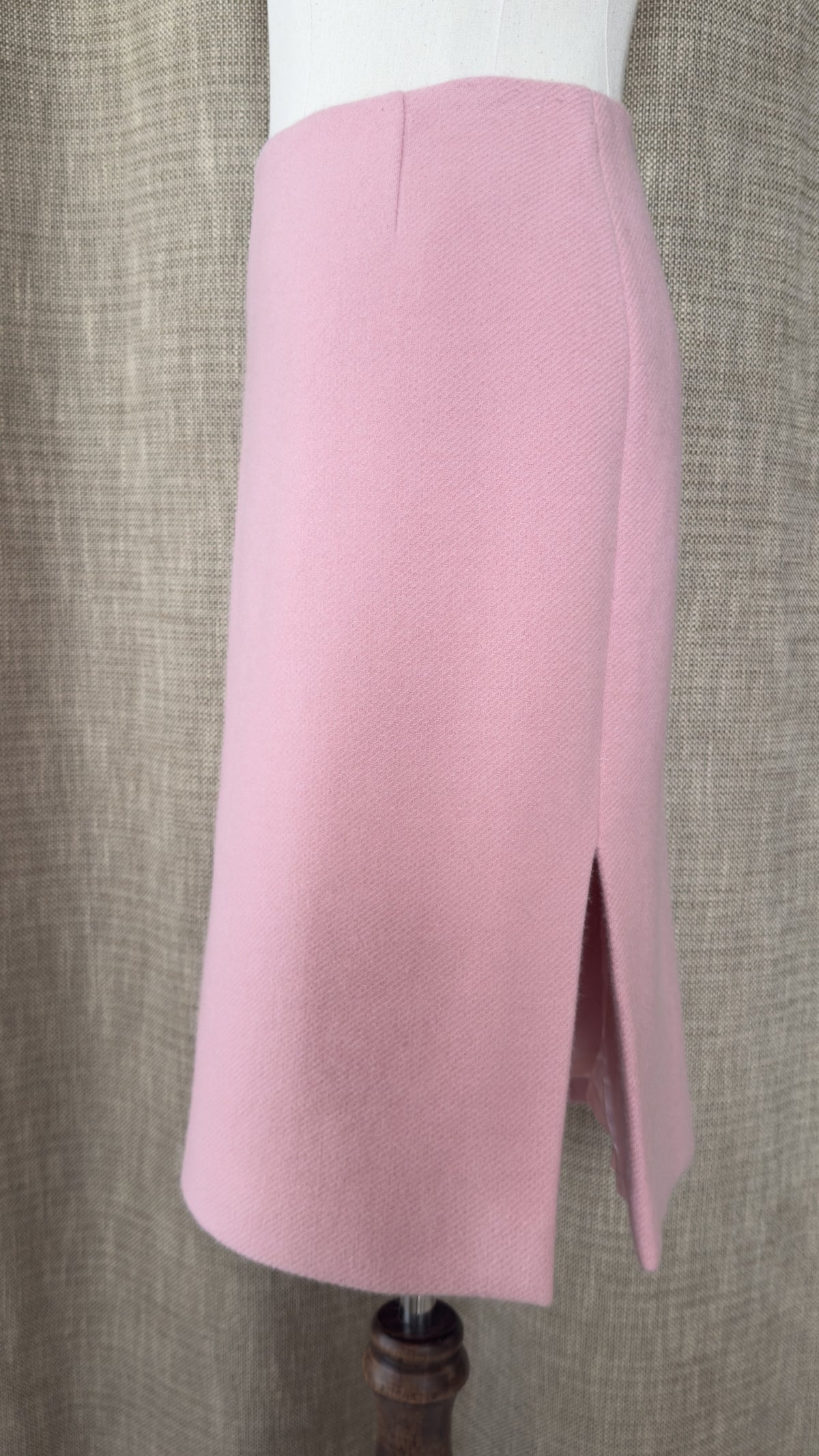 Light pink wool-angora skirt on mannequin, side view