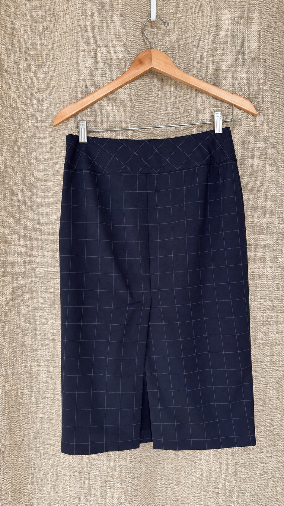 Façonnable dark windowpane wool skirt on hanger, back view