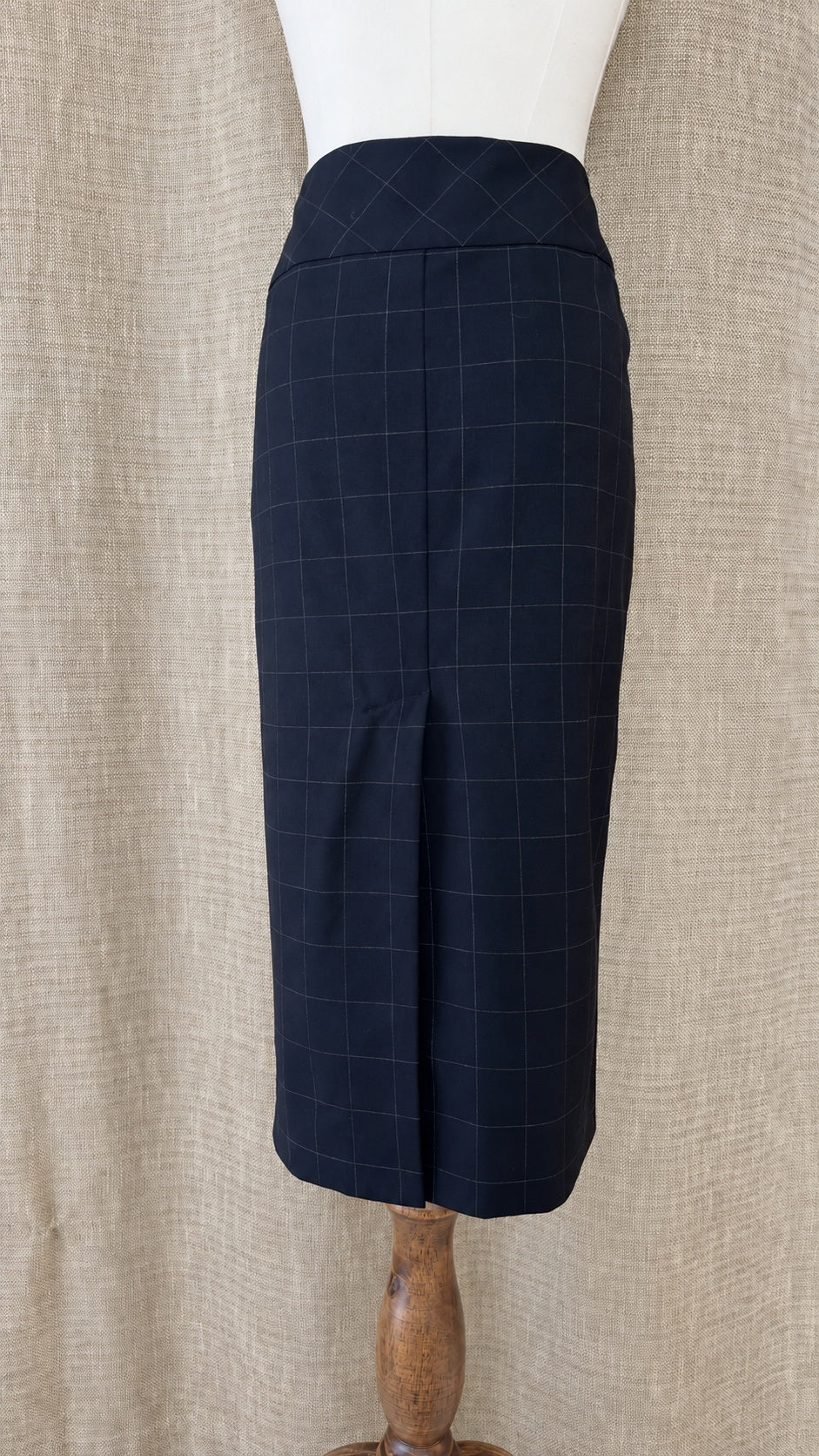 Façonnable dark windowpane wool skirt on mannequin, back view