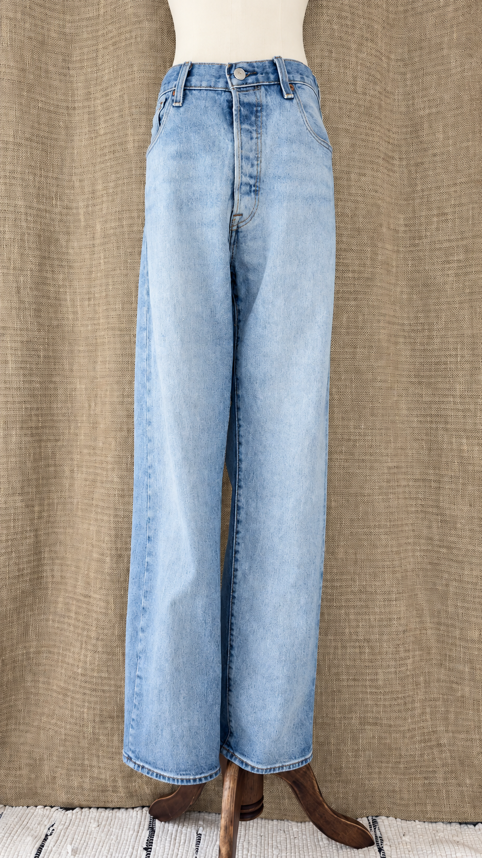 Levi's 501 light-wash jeans on mannequin, front view