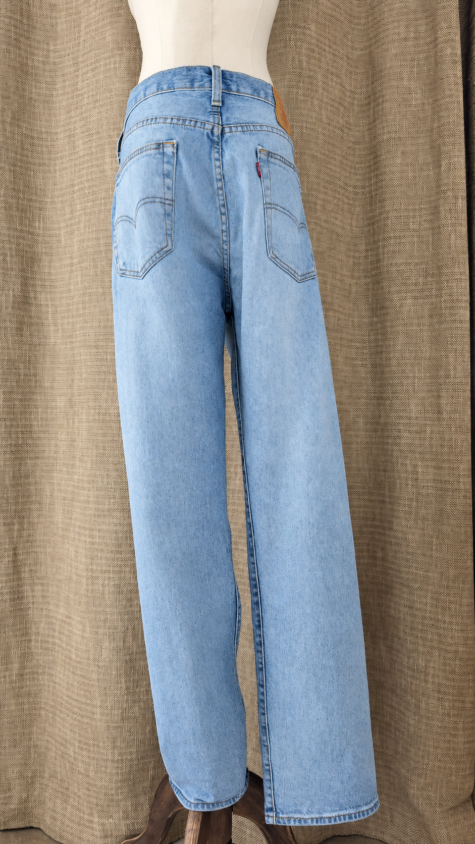 Levi's 501 light-wash jeans on mannequin, back view