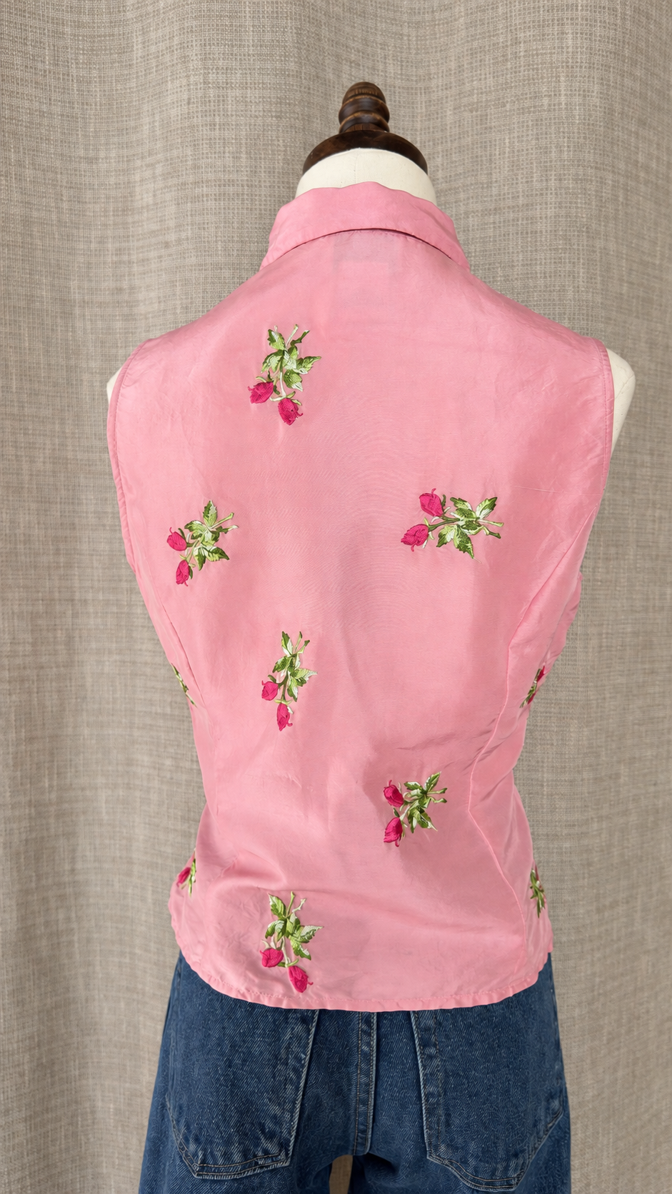 Vision Apparel pink silk top on mannequin, back view